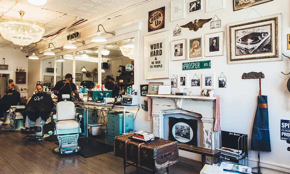 Detroit Barbers shop interior with vintage barber chairs, mirrors and framed photographs
