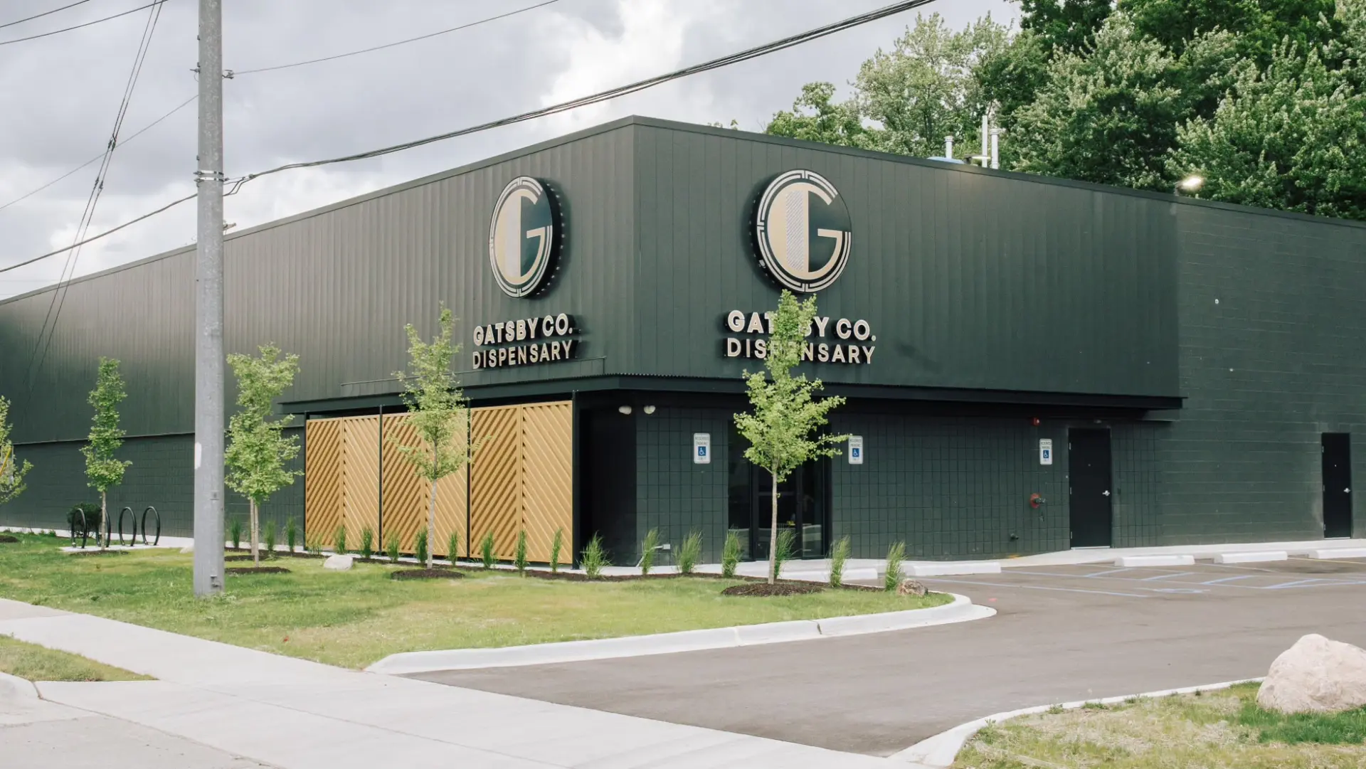 Exterior of the Gatsby Co. Dispensary building with its logo signage
